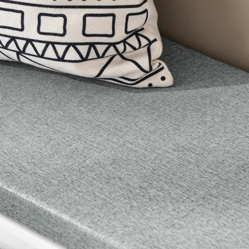 Banc à chaussures design scandinave blanc avec assise confortable et rangement coulissant, parfait pour l'entrée.
