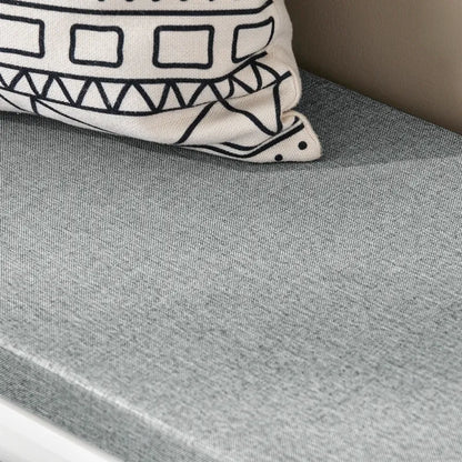 Banc à chaussures design scandinave blanc avec assise confortable et rangement coulissant, parfait pour l'entrée.