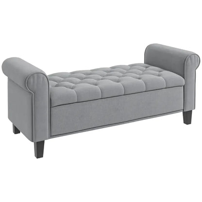 Banc coffre classique en velours gris capitonné, style suite Bellina, avec design élégant et finition douce.