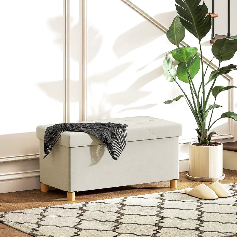 Banc coffre de rangement pliable en velours crème avec design scandinave élégant, idéal pour la décoration intérieure.