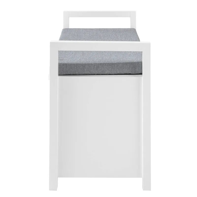 Banc coffre d'entrée Scandinave blanc avec coussin gris et espace de rangement discret, design moderne et épuré.