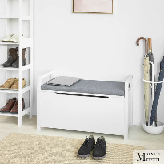 Banc coffre d'entrée Scandinave blanc avec coussin gris et espace de rangement discret, moderne et fonctionnel pour l'entrée.