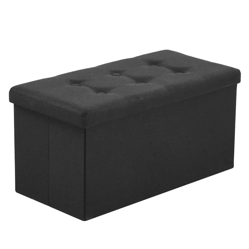 Banc coffre pliable noir avec assise confortable et design décoratif, parfait pour rangement et décoration intérieure.