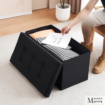 Banc coffre pliable noir avec assise confortable et design décoratif, idéal pour rangement et décoration intérieure.