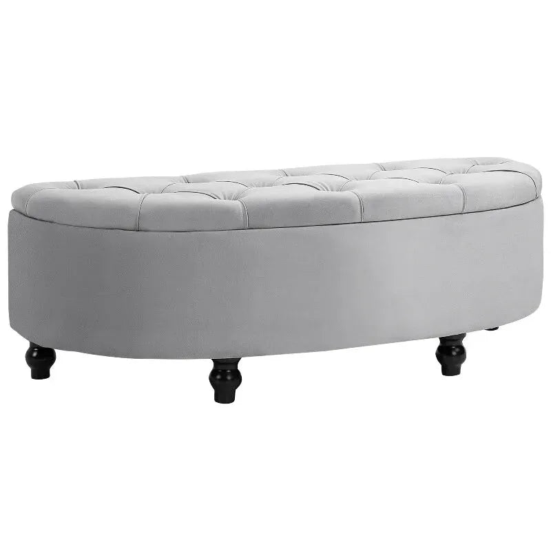 Banc coffre en velours gris de Maison Banc avec design chic et espace de rangement discret.