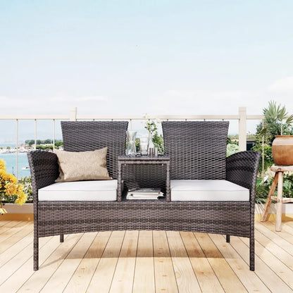 Banc de jardin en rotin noir avec table intégrée, design moderne, confort élégant pour espace extérieur.