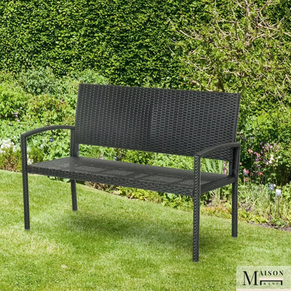 Banc de jardin moderne minimaliste de Maison Banc avec structure en métal noir et assise en rotin résistant.